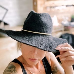 Black woven hat with gold brim band